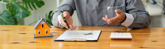 man signing an agreement