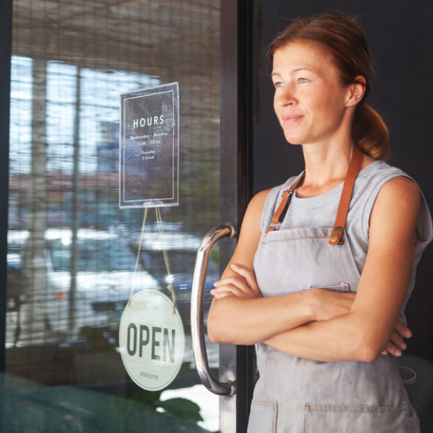 owner of a cafe sits in the door 1