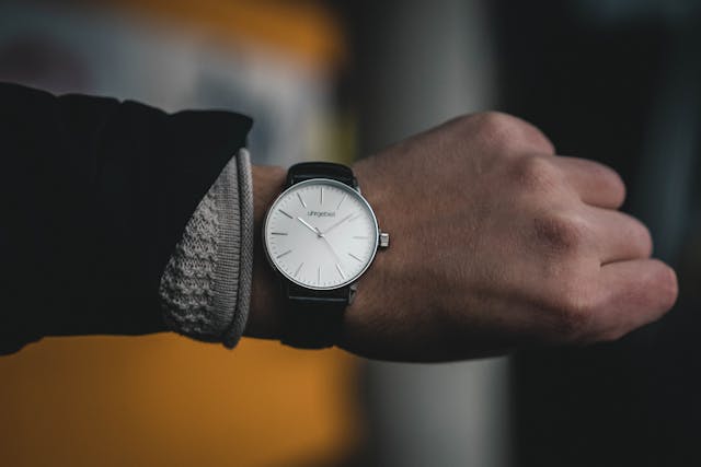 man checking watch
