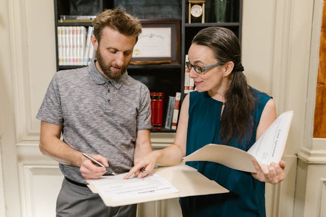 man and woman discussing lease agreement