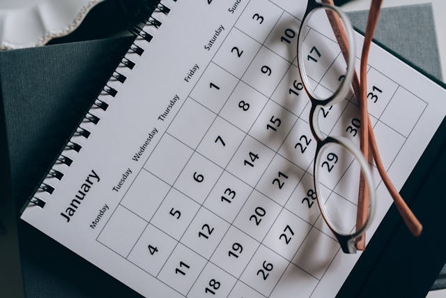 calendar and pair of glasses