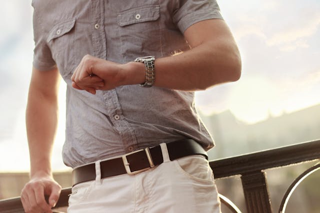 man looking at watch